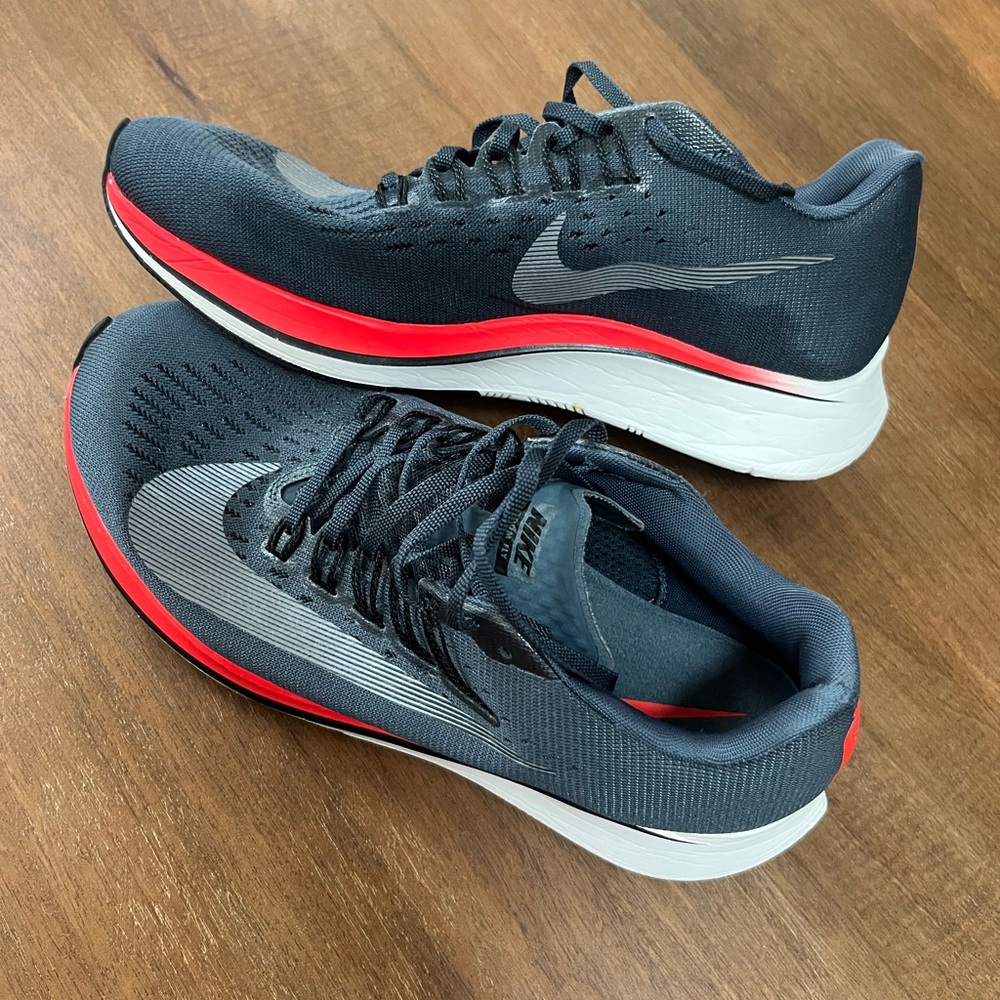 Nike Athletic Shoes Blue and Red Performance Design. Running shoes.